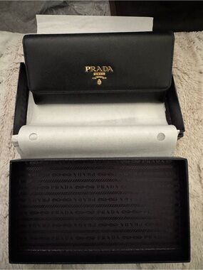Prada Black Saffiano Leather Continental Wallet with Gold Logo.